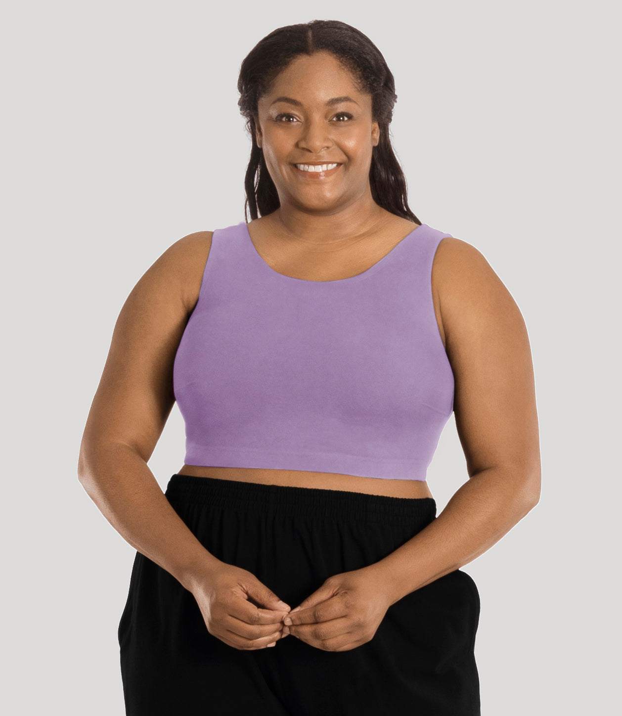 Plus size model, facing front, wearing stretch naturals full fit scoop neck bra in color lavender.
