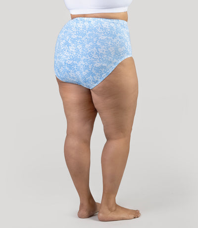 Lower half of plus size model, wearing Junowear Cotton Stretch Full Fit Brief Blue Blossoms Print, facing back.