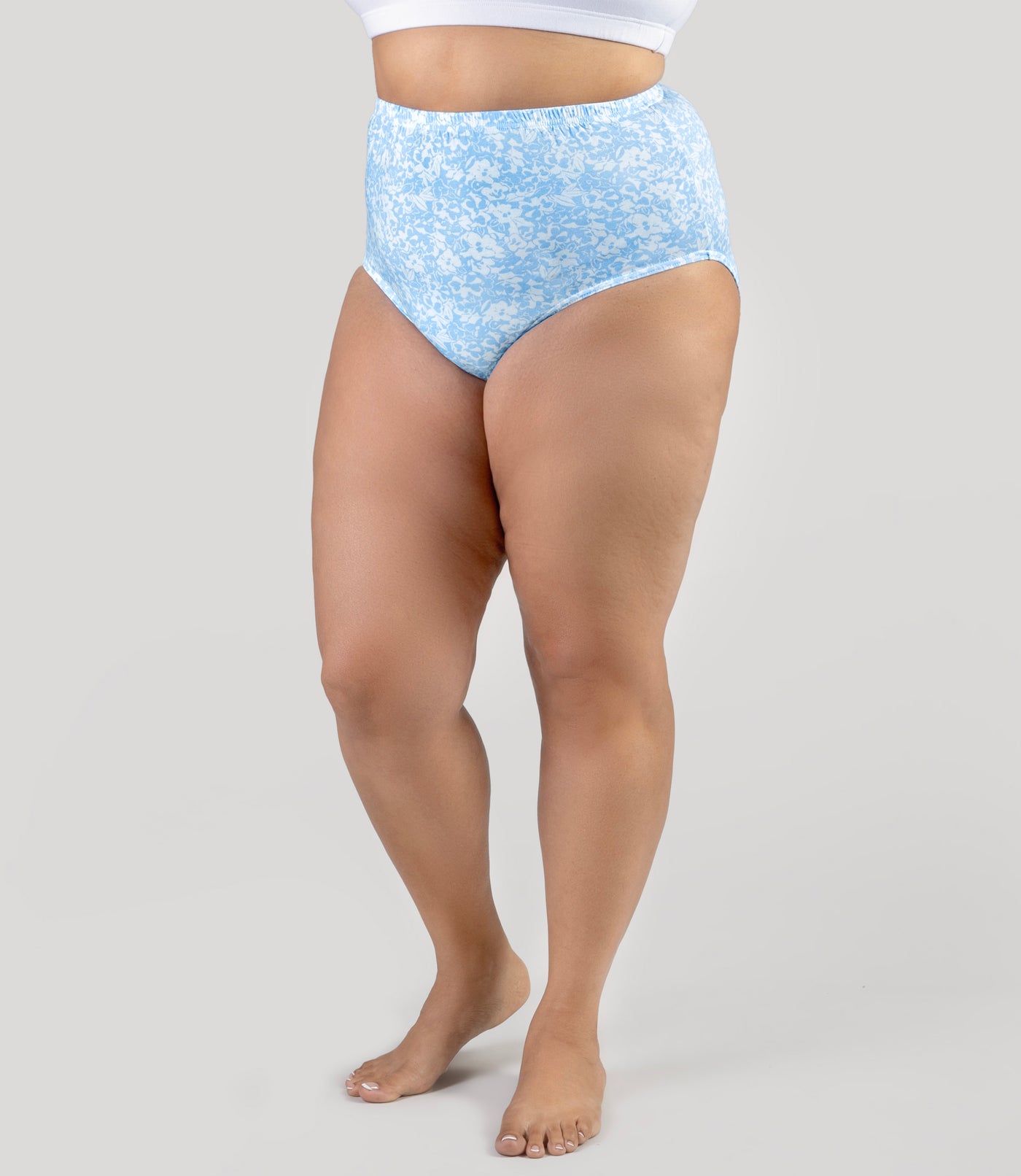 Lower half of plus size model, wearing Junowear Cotton Stretch Full Fit Brief Blue Blossoms Print, facing front.