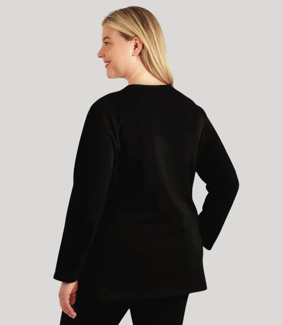 Plus size Woman, facing back, wearing a JunoActive black plus size long sleeve shirt.