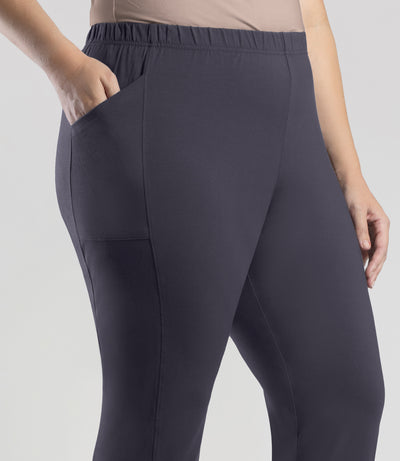 Close up of bottom half of plus sized woman, side view, wearing JunoActive Stretch Naturals Side Pocket Loose Fit Leggings in color oak gray.