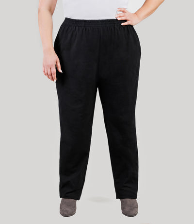 Plus size model, facing front, lower half of body from waist down, wearing JunoActive's Stretch Naturals Full Fit Pear plus size Pant in color black.