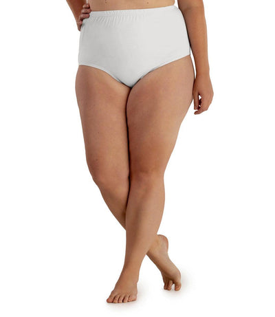 Bottom half of plus sized woman, facing front, wearing JunoActive Junowear Hush Full Fit Briefs in white. This brief has a high waist fit with conservative leg opening