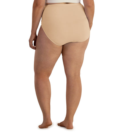 Bottom half of plus sized woman, facing back, wearing JunoActive Junowear Hush Full Fit Briefs in ecru. This brief has a high waist fit with conservative leg opening