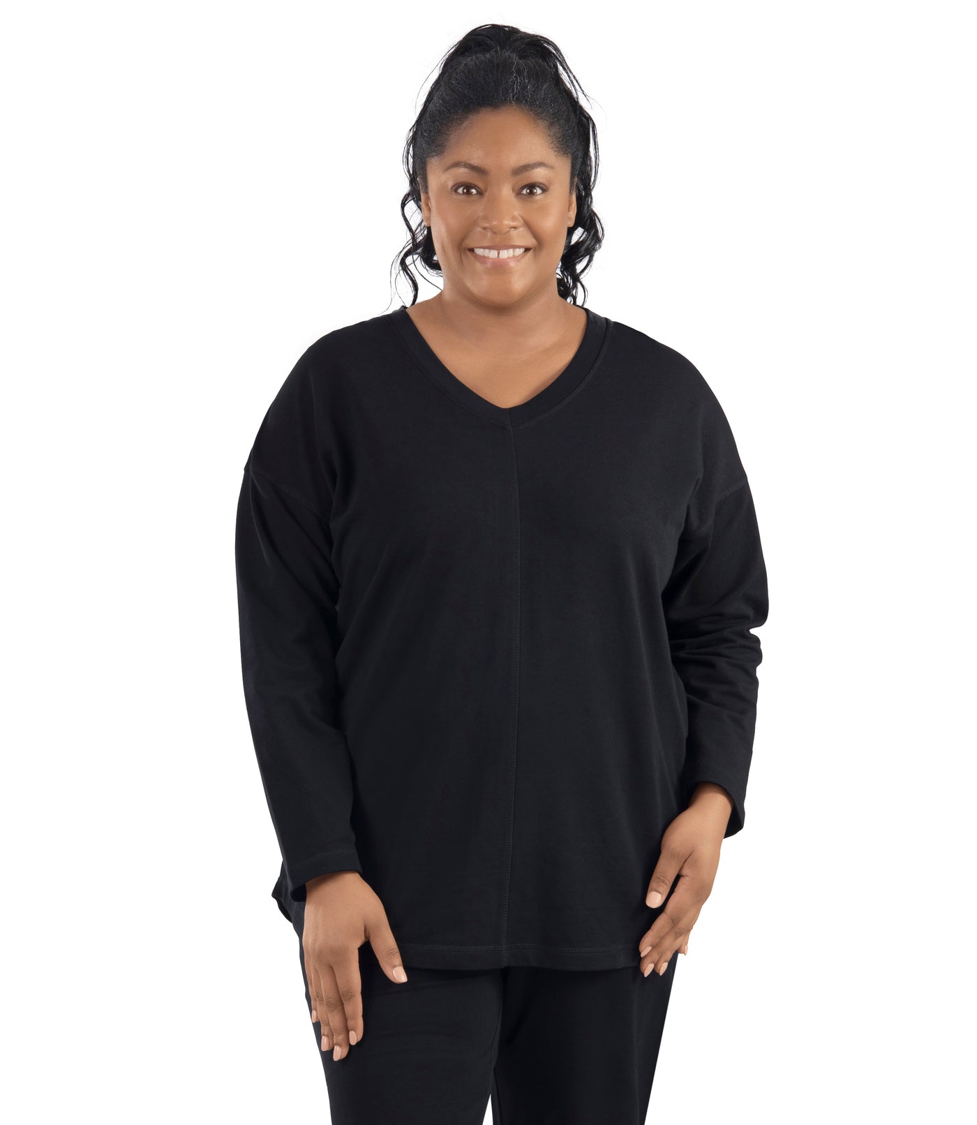Plus-size women, facing front, wearing Mavie Drop Shoulder V-Neck Tunic in color black.