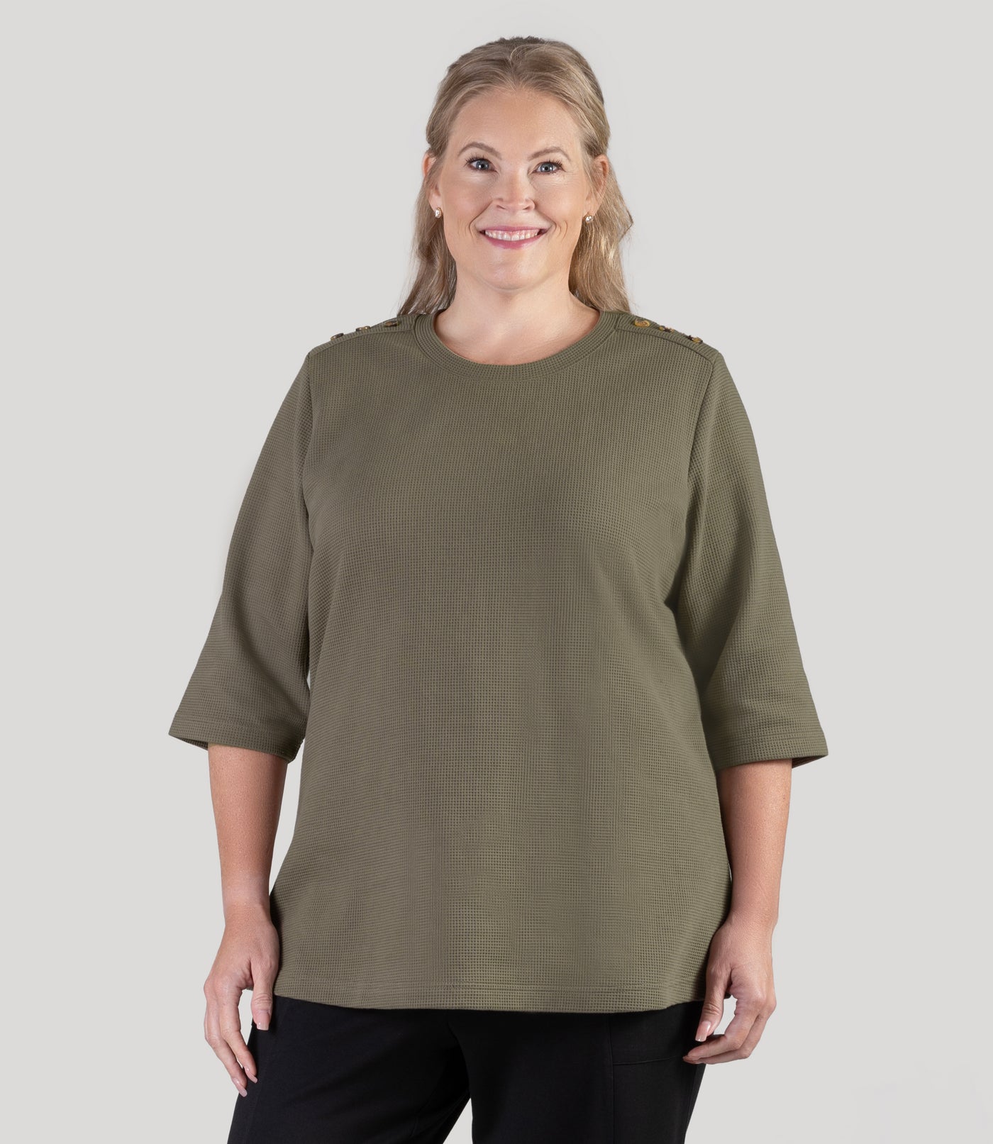 Plus size model, wearing JunoActive's JunoWaffle 3/4 Sleeve Button Top in color olive.