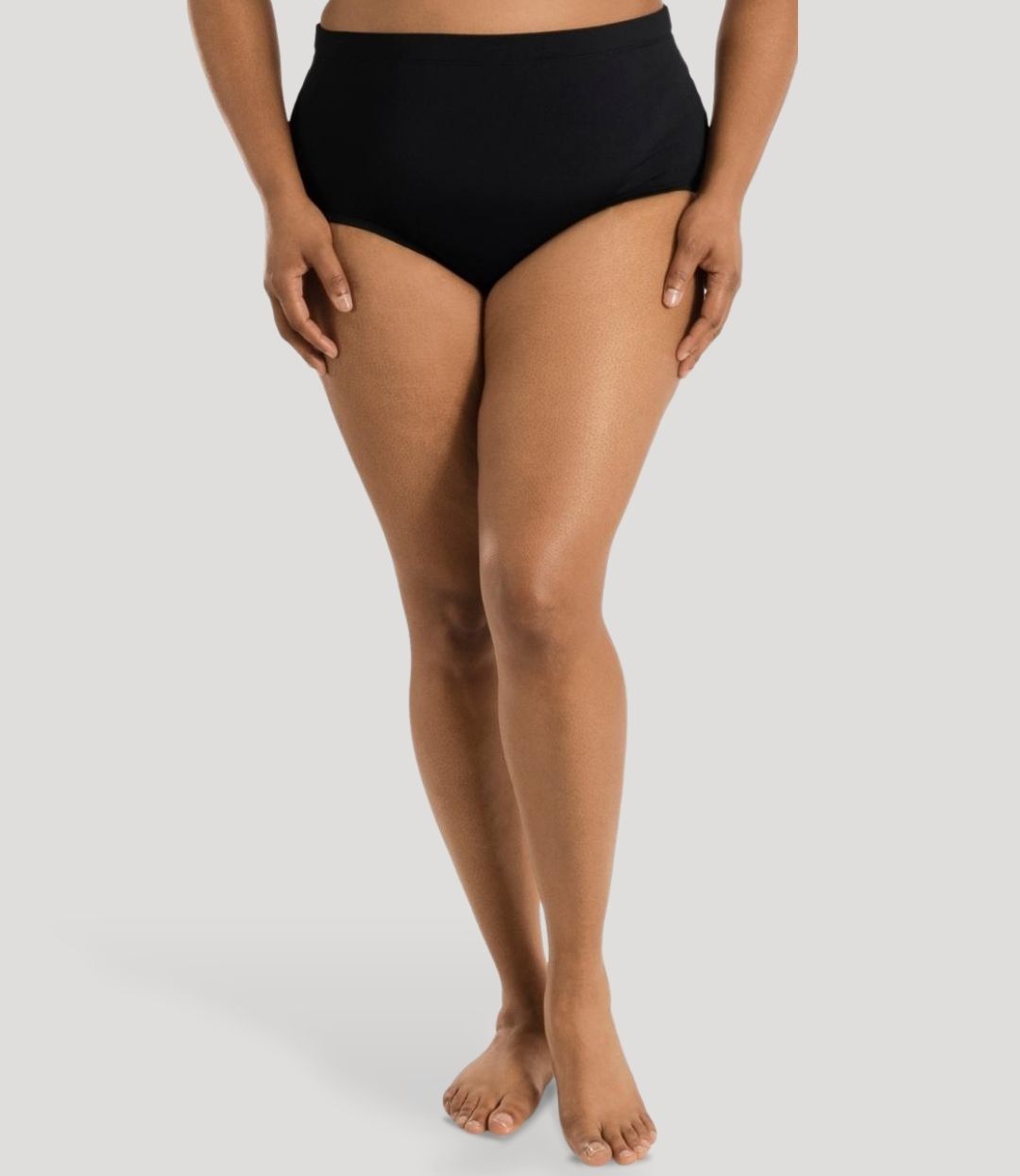 Model, facing front, wearing JunoActive's Aquasport swim brief in color black.