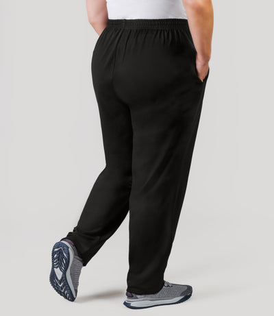 Plus size model, facing back, wearing JunoActive's Softwik Pear plus size Pant in color black.