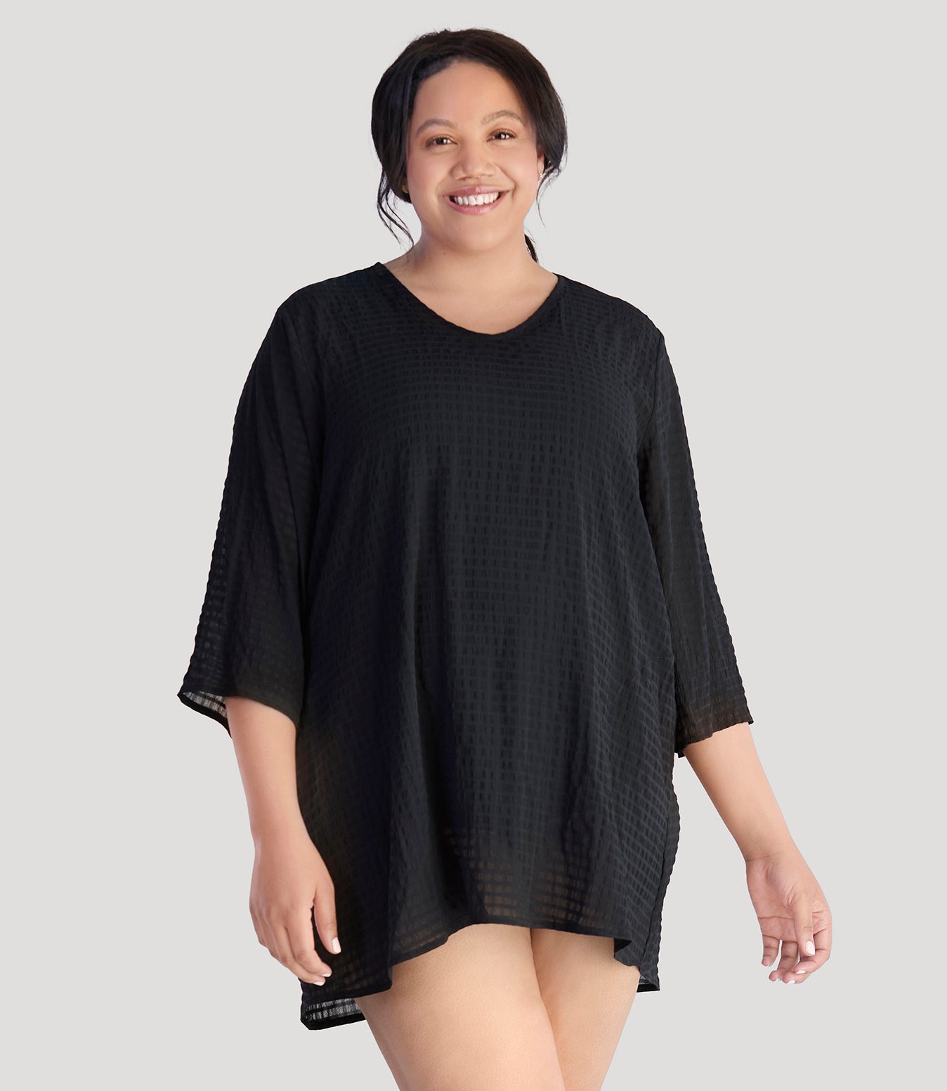Plus size model, facing front, wearing JunoActive's BellaStyle Tunic Cover-up in color black.