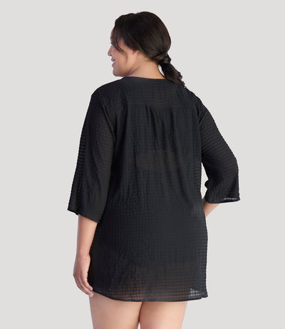Plus size model, facing back, wearing JunoActive's BellaStyle Tunic Cover-up in color black.
