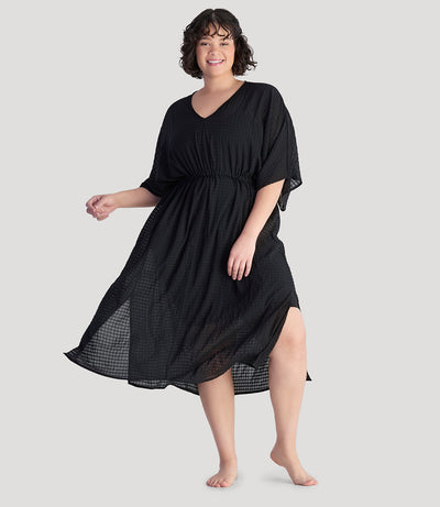Plus size model, facing front, wearing JunoActive's BellaStyle V-Neck Long Gathered Caftan in color black.