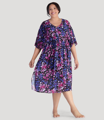 Plus size model, facing front, wearing JunoActive's BellaStyle V-Neck Long Gathered Caftan in floral elegance print.