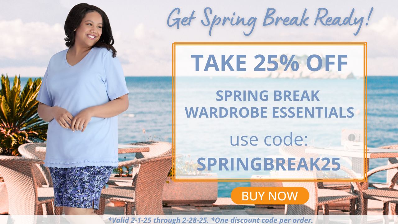 Plus size model smiling looking over her shoulder wearing JunoActive plus size clothing, a light blue short sleeve top and a pair of shorts in a blue, white and black small floral print. The background is an outdoor dining area overlooking the sea. Take 25% off spring break essentials with code springbreak25 this offer is valid through the month of February.