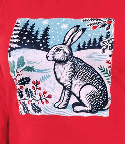 Close up of the Designer Graphic Stretch Naturals plus size Long Sleeve V-Neck Top in Lucky Red. The graphic  is of a rabbit in a winter scene with red berries and green pine leaves.