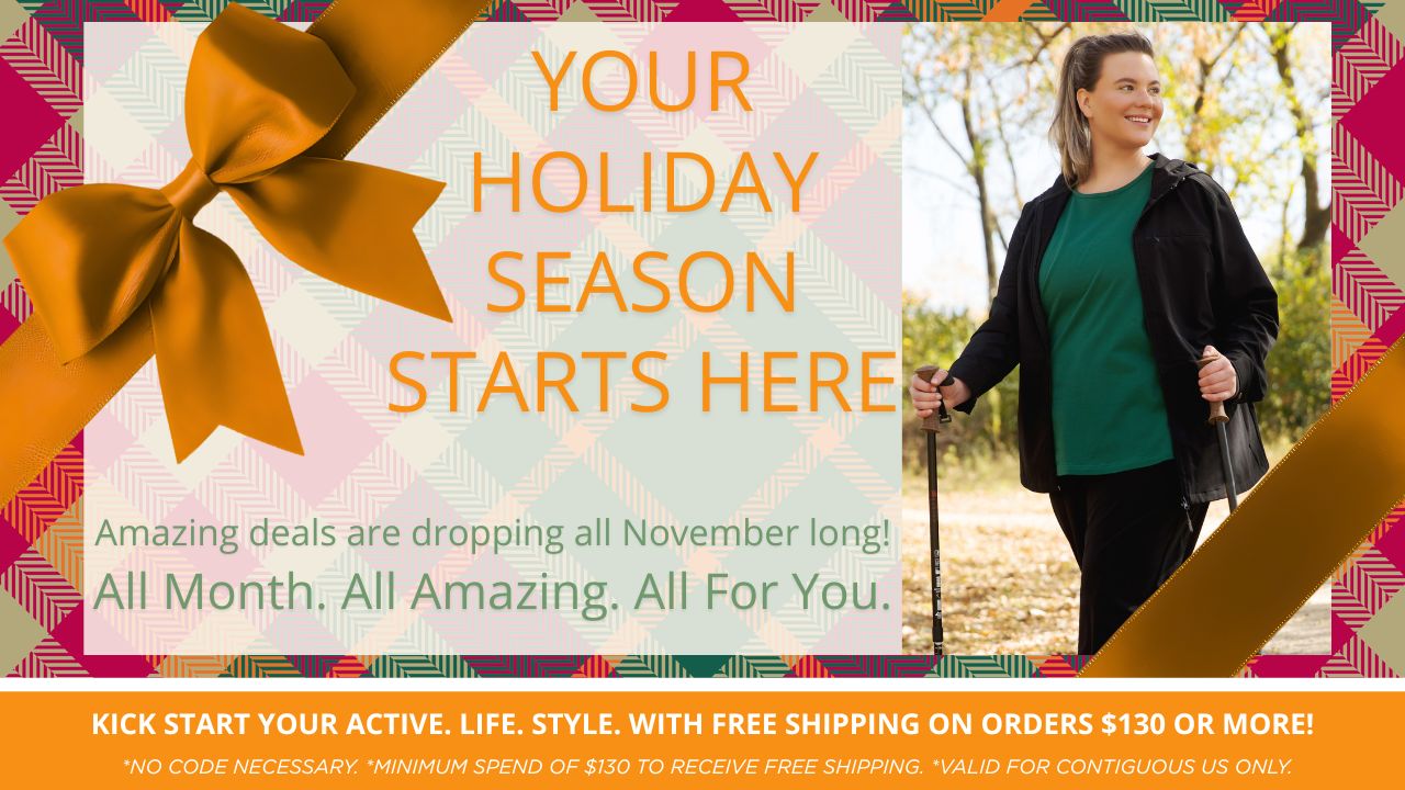 JunoActive plus size women's activewear Holiday Season kickoff. Amazing Deals all November long. Bonus, free shipping on orders of $130+ for contiguous US only. Featuring orange bow with plaid background showing a plus size woman hiking while wearing a JunoActive hiking plus size jacket, top and pants.