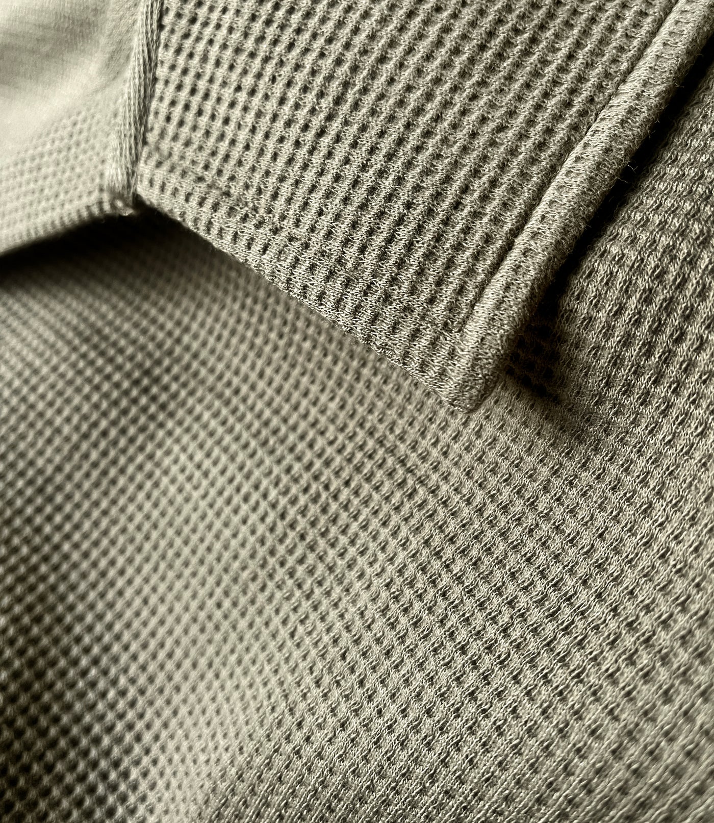 Close up of JunoActive's JunoWaffle Cotton Long Sleeve Button top in color olive.