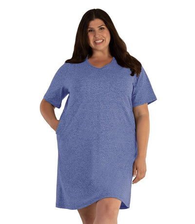 Plus size woman, facing front, wearing JunoActive SoftWik short sleeve dress with pockets. Sleeves are longer and just before elbow. Hemline is above knees. The color is heather royal. 