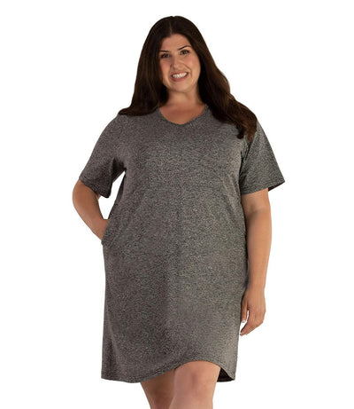Plus size woman, facing front, wearing JunoActive SoftWik short sleeve dress with pockets. Sleeves are longer and just before elbow. Hemline is above knees. The color is heather gray. 