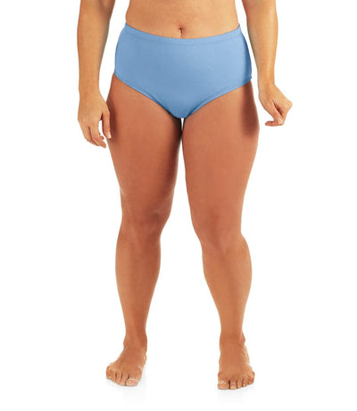 Bottom half of plus sized woman, facing front, wearing JunoActive QuikWik Comfort Briefs in columbia blue. This brief fits just below the belly button with conservative leg opening.