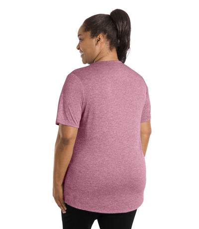 Plus size woman wearing JunoActive's SunLite Scoop Neck back view wearing black pants and hands by side in heather ruby.