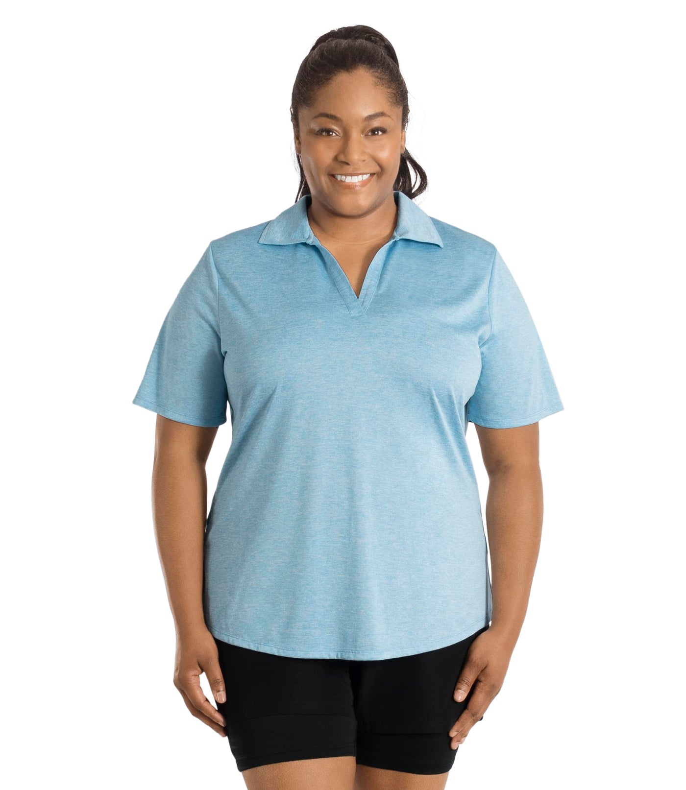 Plus size woman wearing JunoActive's SunLite Johnny Collar Top in heather light blue facing front.