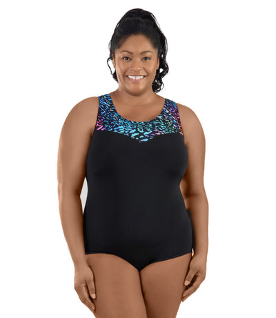 Plus-size model wearing JunoActive's QuikEnergy Sweetheart Tank Suit in coral reef. Model is facing front and hands by her side.