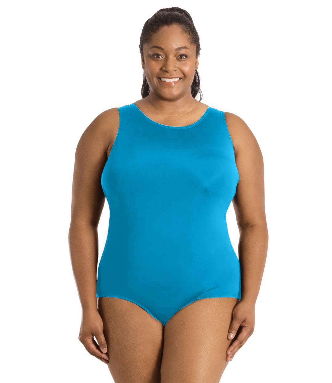 Plus size woman, facing front, wearing JunoActive plus size QuikEnergy Spa Suit Turquoise. The suit is solid Turquoise, has a scoop neckline and conservative leg opening.