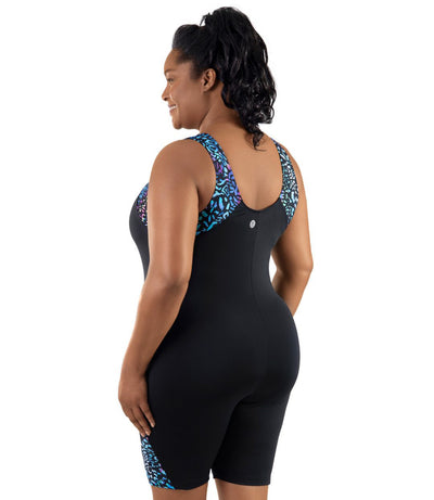 Plus-size model wearing JunoActive's QuikEnergy Aquatard in coral reef print. She is facing back with her hands by her side.