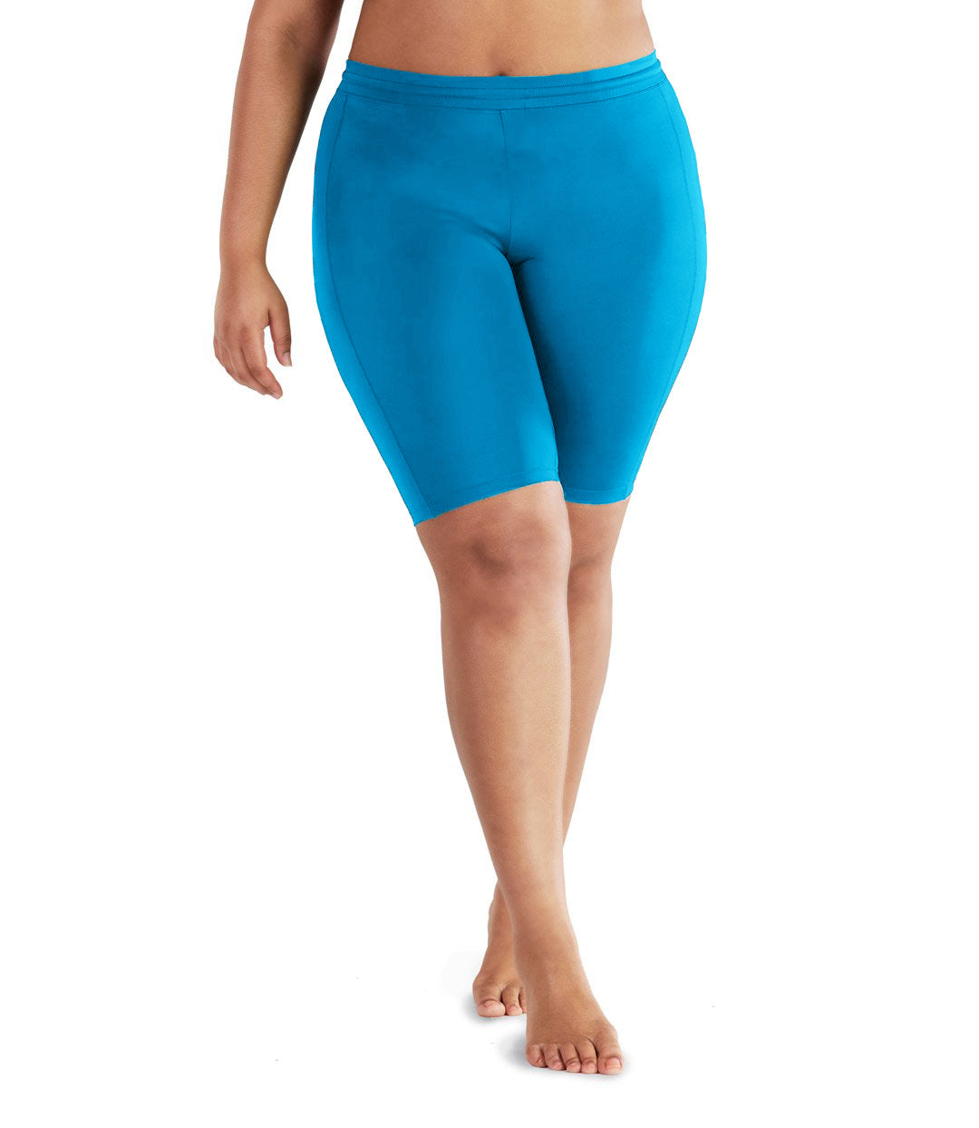 Bottom half of plus size woman facing front  wearing JunoActive QuikEnergy Fitted Swim Short.  The short is turquoise and is tight to the body.  The hem is just above the knee.