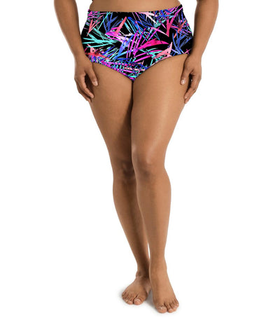 Plus size woman, facing front, wearing AquaSport Swim Brief Sunset Palm Print. Pink, blue and teal abstract line print on the entire swim bottom. Conservative leg opening. 