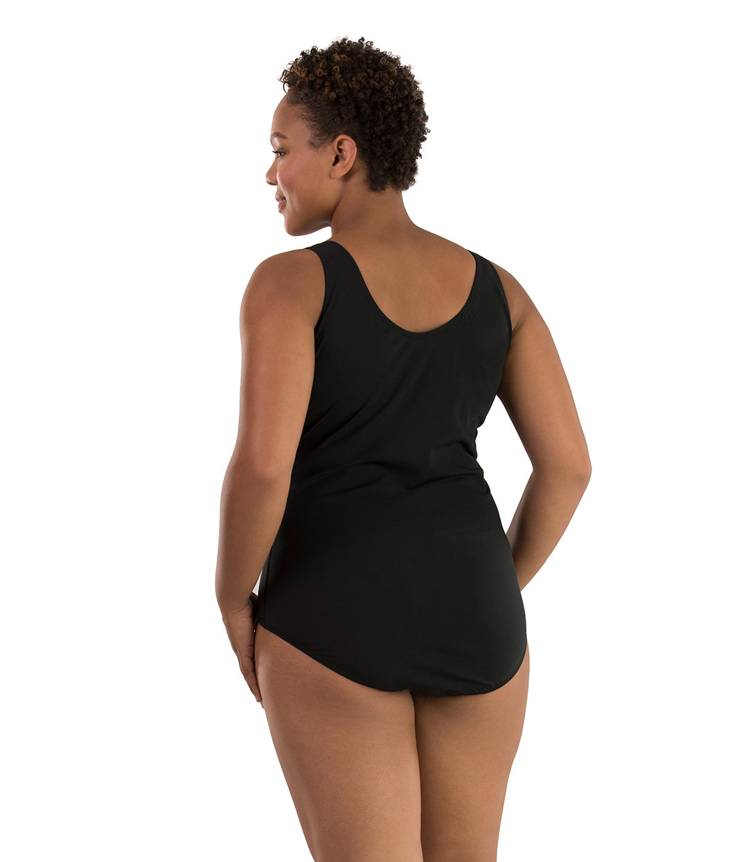 Plus size woman, back view, wearing JunoActive plus size AquaSport Princess Seam Tanksuit Tall Ocean Blues Print Black.  The back of the suit is solid black with a scoop neckline.
