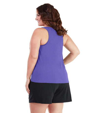 Plus size woman, back view, wearing  AquaSport Tankini Top Purple. Solid purple razor back. 