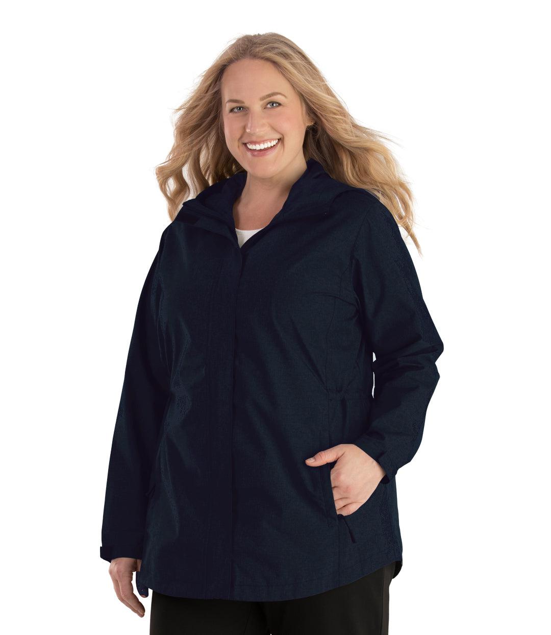 Plus size woman, front view, wearing a JunoActive plus size Waterproof Breathable Wind & Rain Jacket in deep navy. The jacket has a hood, double front closure and side pockets. The length of the plus size jacket hits just below the hips.