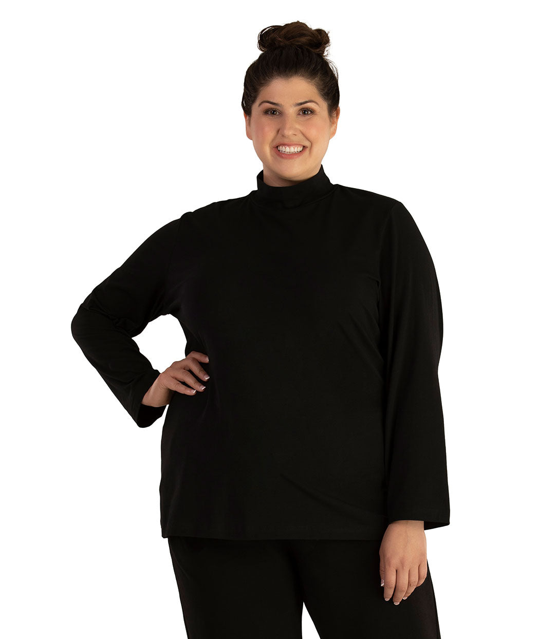Plus size woman, facing front looking left, wearing JunoActive plus size Stretch Naturals Lite Mock Neck Top in the color Black. She is wearing JunoActive Plus Size Leggings in the color Black.