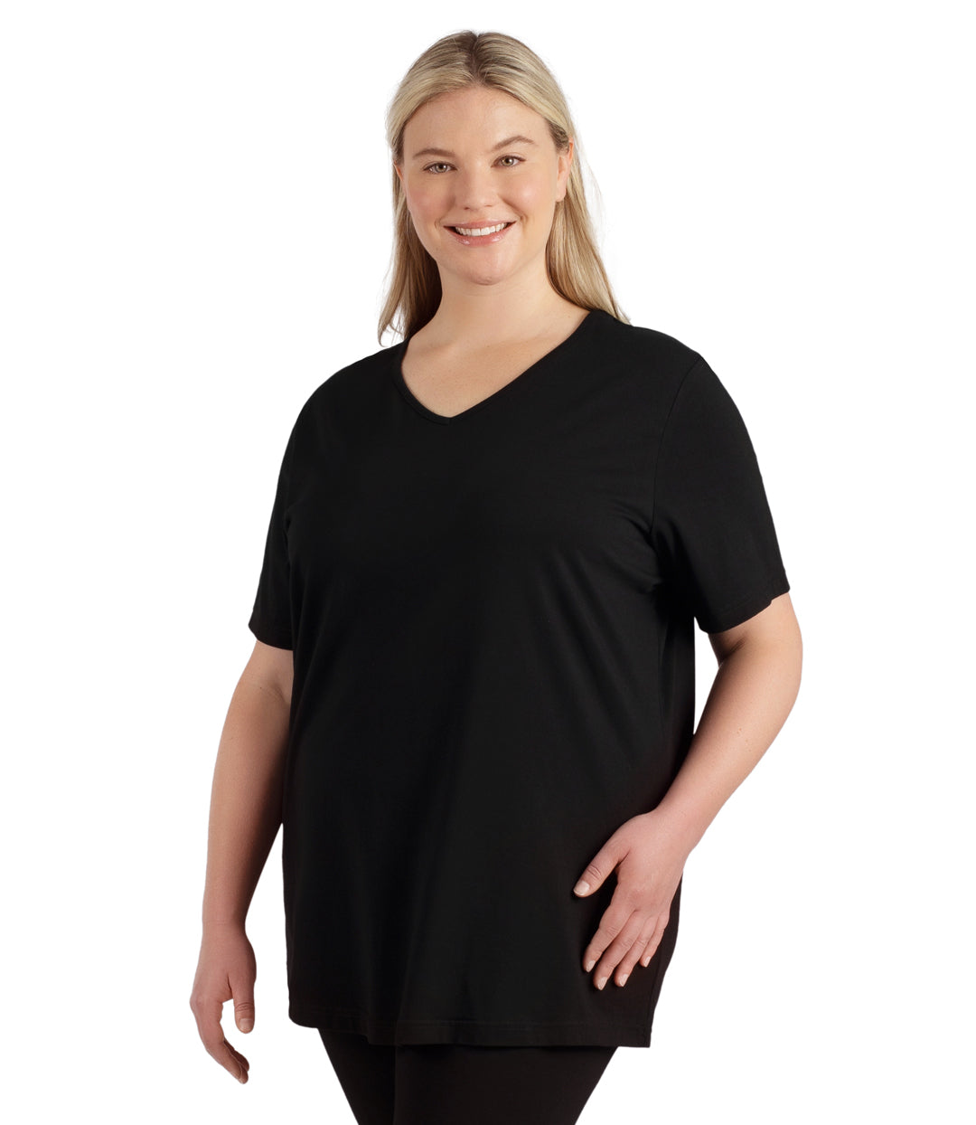 Plus size woman, facing front, wearing JunoActive plus size Stretch Naturals Lite Short Sleeve V-Neck Top in the color Black.   She is wearing JunoActive Plus Size Leggings in the color black. 