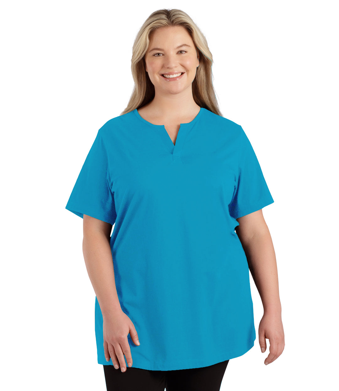 Plus size woman, facing front, wearing JunoActive plus size Stretch Naturals Lite Short Sleeve Split Collar Tunic in the color Aquamarine. She is wearing JunoActive Plus Size Leggings in the color black. 