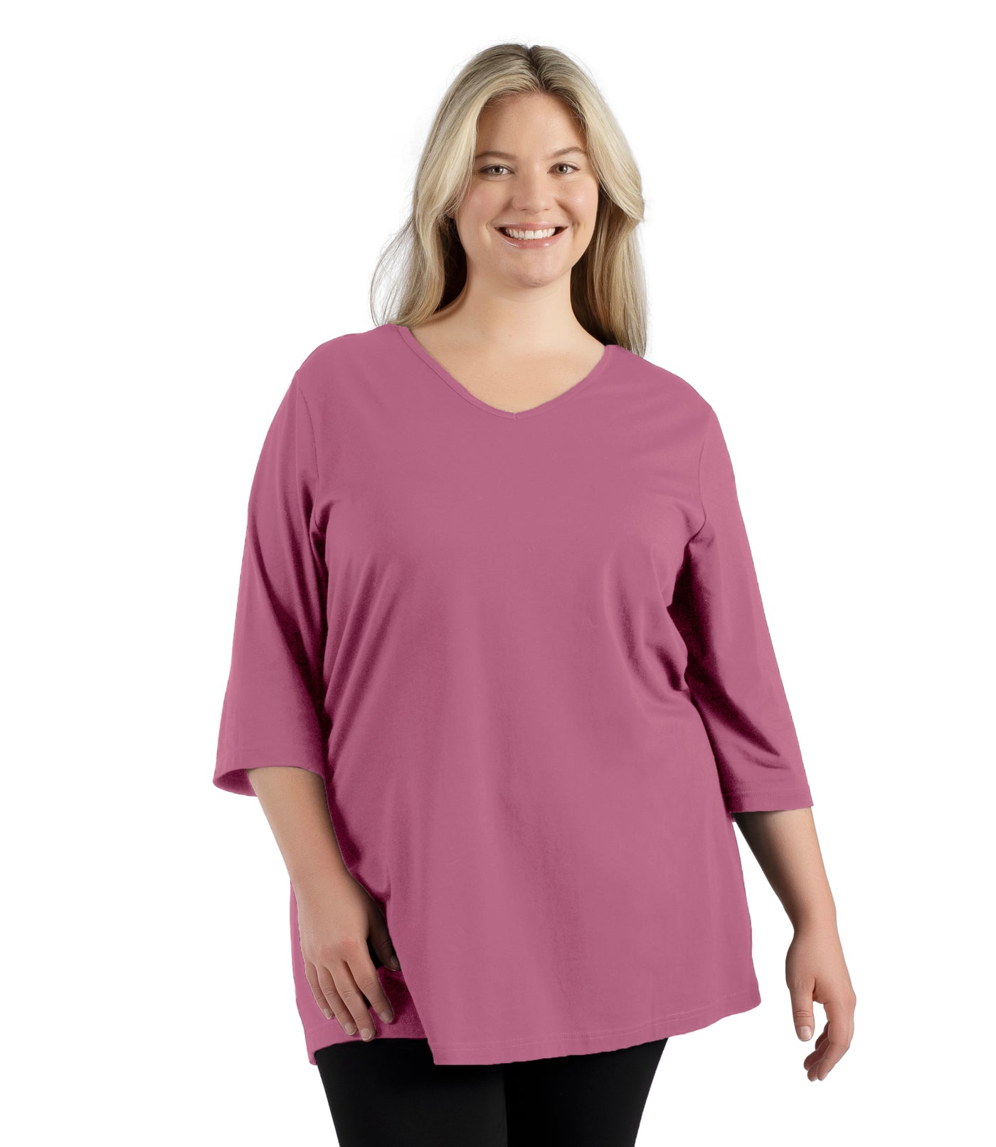 Plus size woman, facing front, wearing JunoActive’s Stretch Naturals Lite 3/4 Sleeve V-neck Tunic, color mulberry. Arms by side.