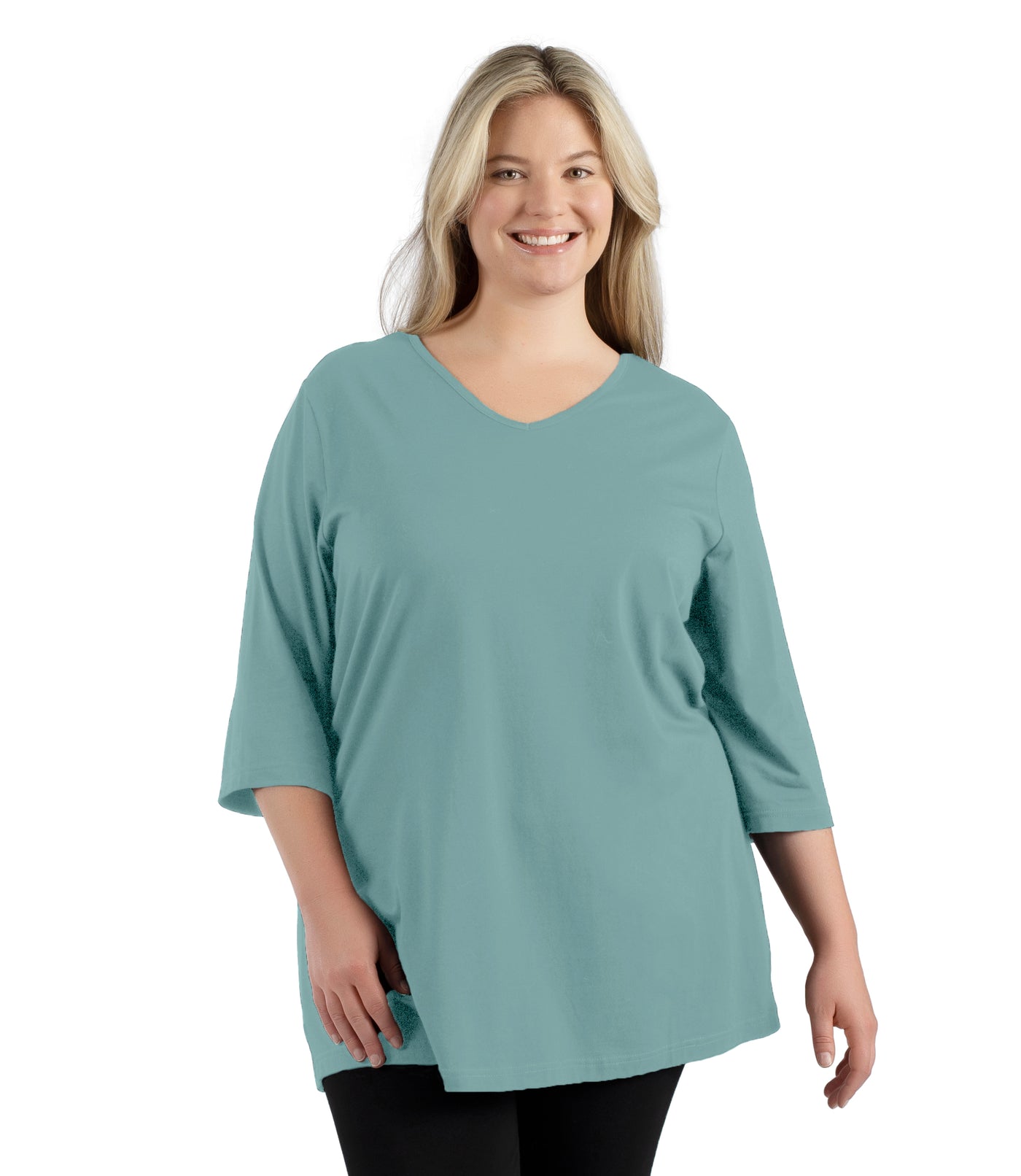 Plus size woman, facing front, wearing JunoActive’s Stretch Naturals Lite 3/4 Sleeve V-neck Tunic, color robin blue. Arms by side.