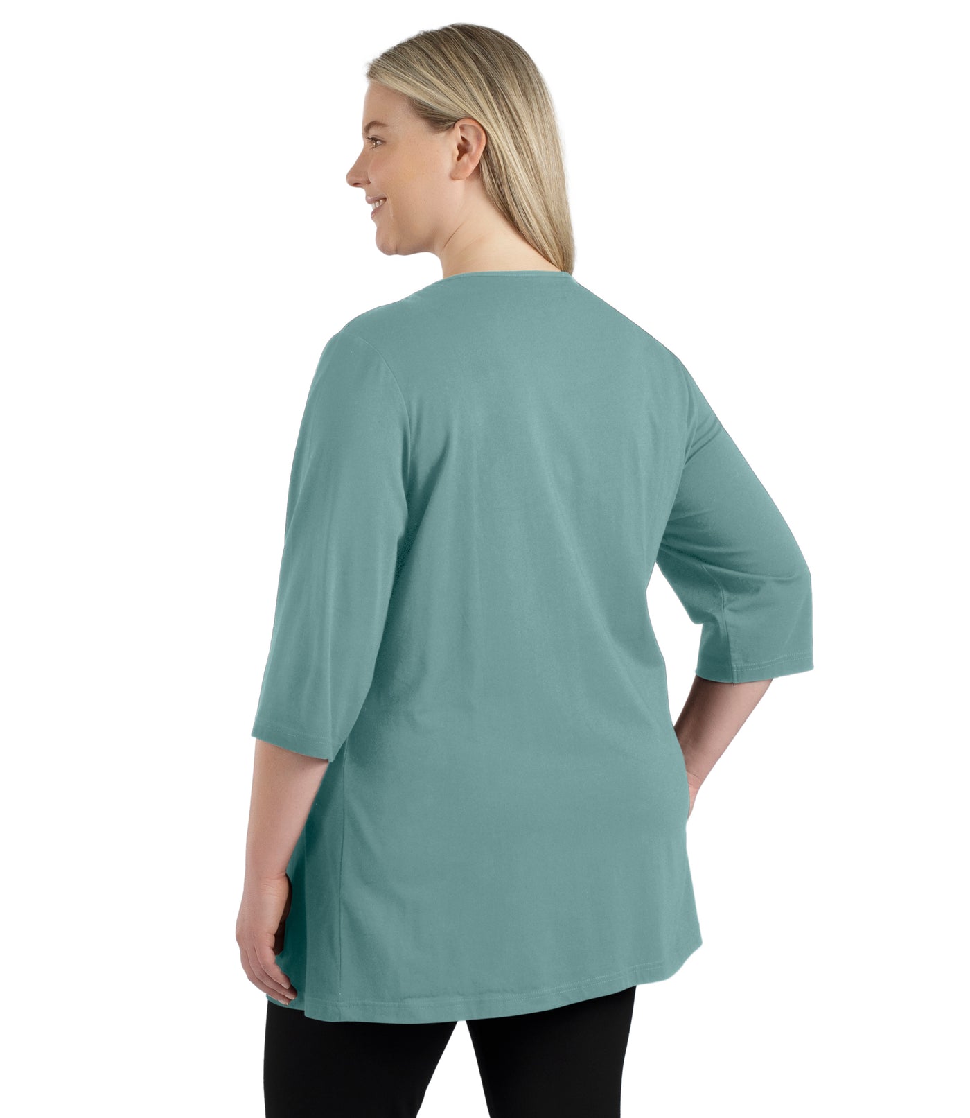 Plus size woman, facing back, wearing JunoActive’s Stretch Naturals Lite 3/4 Sleeve V-neck Tunic, color robin blue. Arms by side.