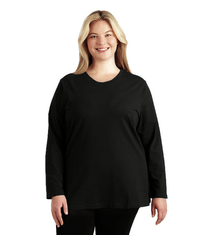 Plus size woman, facing front, wearing JunoActive’s Stretch Naturals Lite Long sleeve scoop neck top, in color black, with her hands by her side. Leggings in black. 
