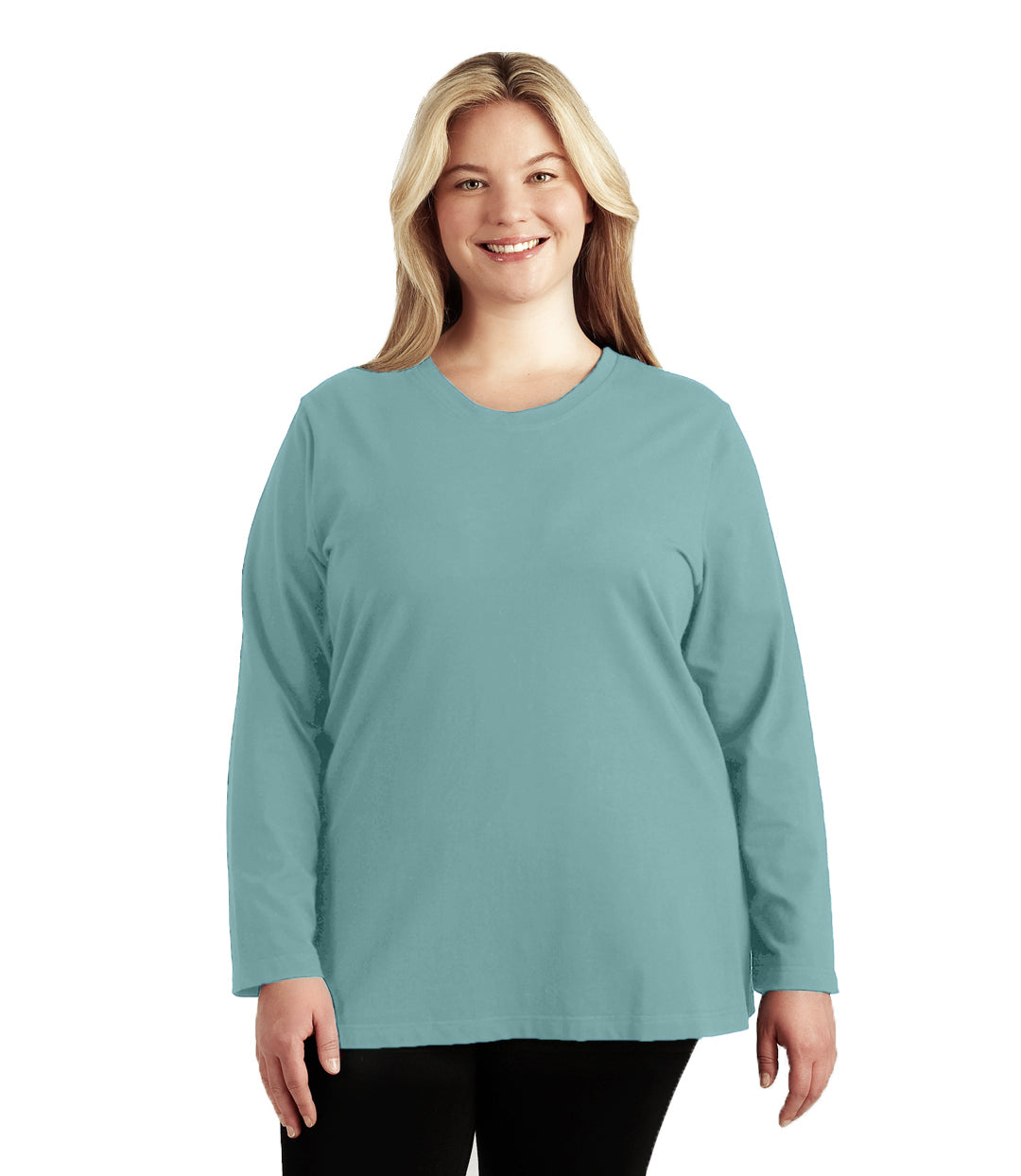 Plus size woman, facing front, wearing JunoActive’s Stretch Naturals Lite Long sleeve scoop neck top, in color robin blue, with her hands by her side. Leggings in black. 