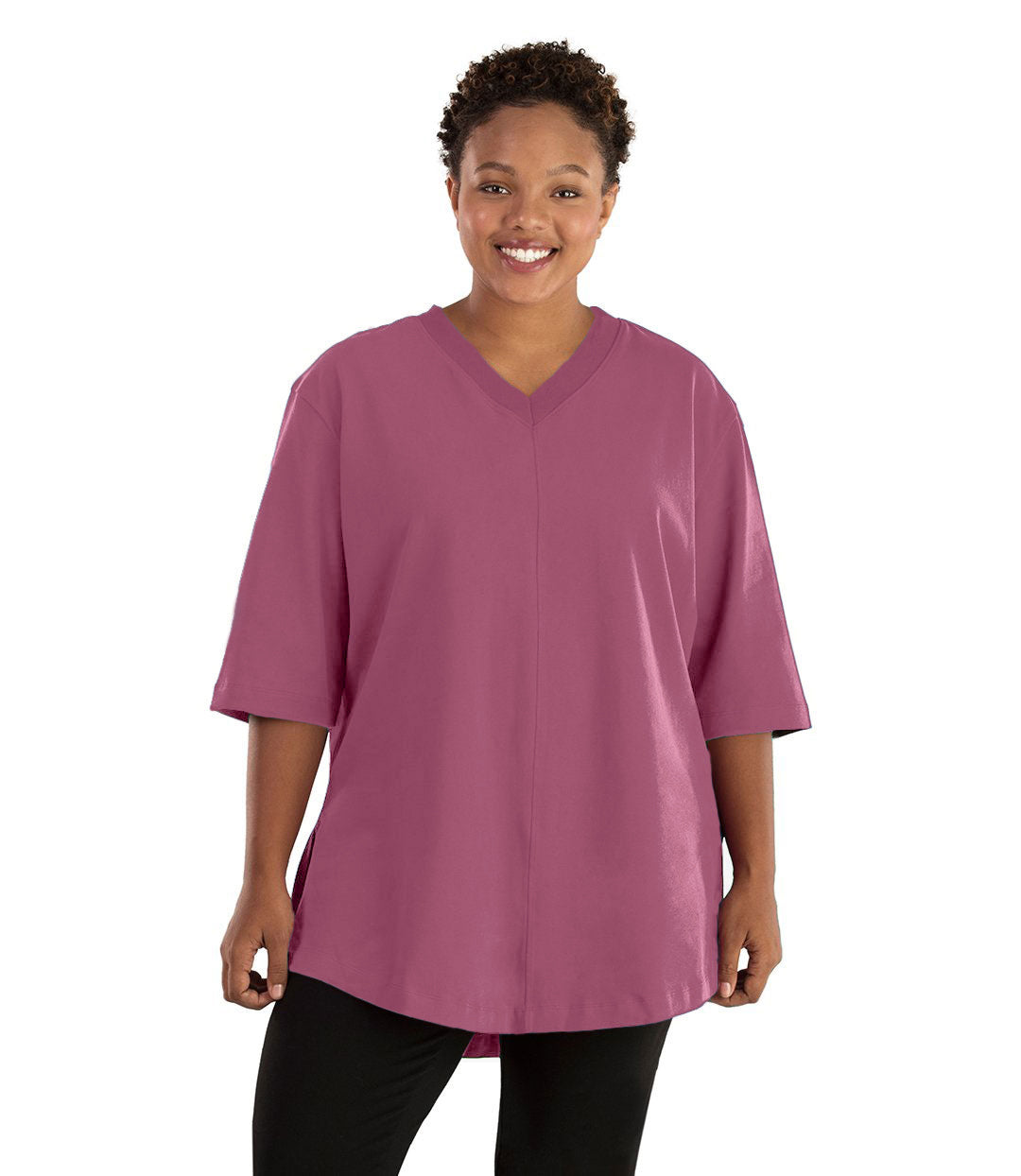 Plus size woman, facing front, wearing JunoActive plus size Legacy Cotton Casual Tunic in the color Dusty Rose. She is wearing JunoActive Plus Size Leggings in the color black. 