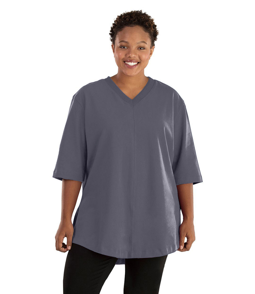 Plus size woman, facing front, wearing JunoActive plus size Legacy Cotton Casual Tunic in the color  Misty Grey. She is wearing JunoActive Plus Size Leggings in the color black.