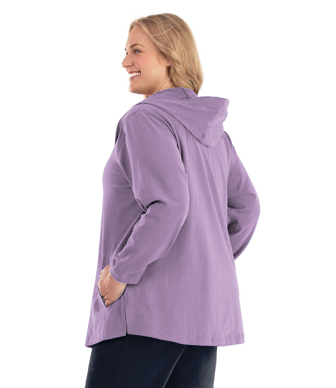 Plus size woman, facing back, wearing Legacy Cotton Casual Button Up Hoodie in Lavender. Both hands are in side pockets of hoodie. 