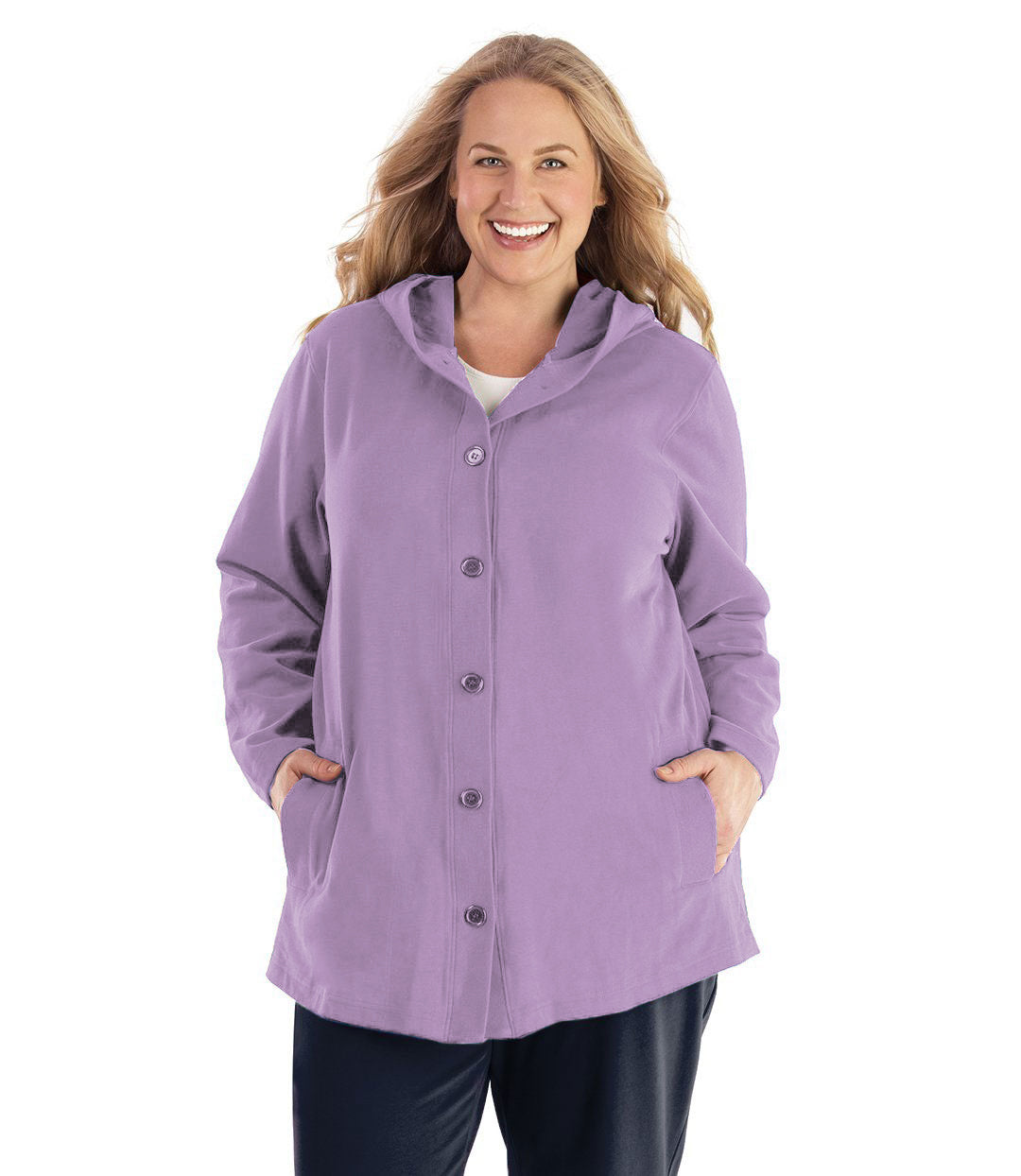 Plus size woman wearing Legacy Cotton Casual Button Up Hoodie in Lavender. Both hands are in side pockets of hoodie. 