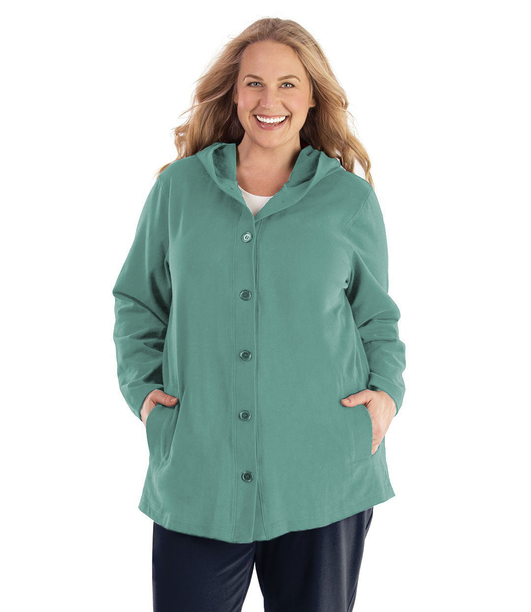 Plus size woman wearing Legacy Cotton Casual Button Up Hoodie in Lichen Green. Both hands are in side pockets of hoodie.