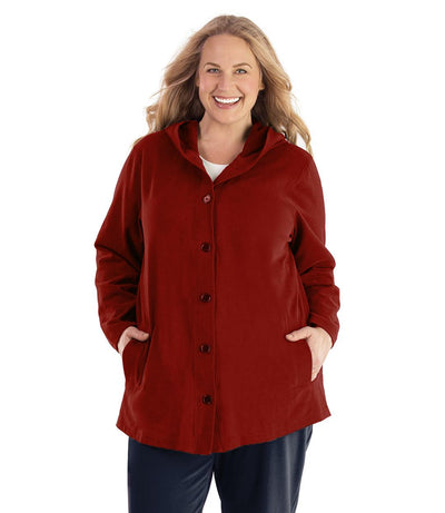 Plus size woman, facing front, wearing JunoActive plus size Legacy Cotton Casual Button Up Hoodie in the color Merlot Red. She is wearing JunoActive Plus Size Leggings in the color Black.