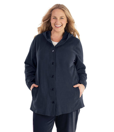 Plus size woman, facing front, wearing JunoActive plus size Legacy Cotton Casual Button Up Hoodie in the color Navy Blue. She is wearing JunoActive Plus Size Leggings in the color Black.