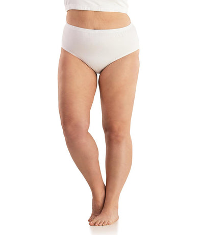 Bottom half of plus sized woman, facing front, wearing JunoActive Junowear Cotton Stretch Classic Brief in white. This brief fits to the waistline with conservative leg opening.