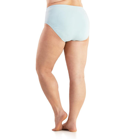 Bottom half of plus sized woman, back view, wearing JunoActive Junowear Cotton Stretch Classic Brief in light blue. This brief fits to the waistline with conservative leg opening.